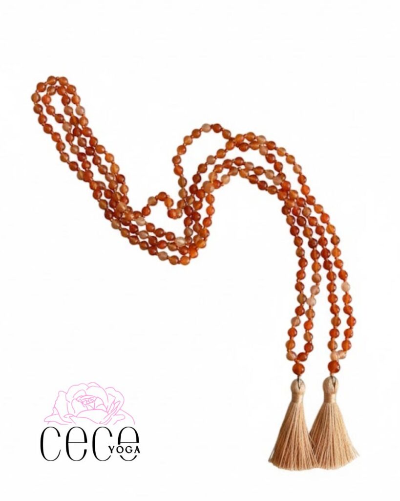 Handmade carnelian yoga mala necklace with tassels for meditation and sacral chakra healing